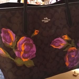 Brown and black Coach with Purple flowers